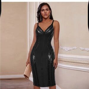 Black knee-length bodycon cocktail dress with sleeveless design and v-neckline